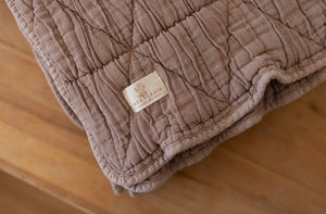 New Grain Quilted Crib Blanket in Cinnamon