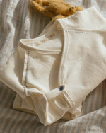 ferne baby Flap Footie - Milk with Blue Stitching