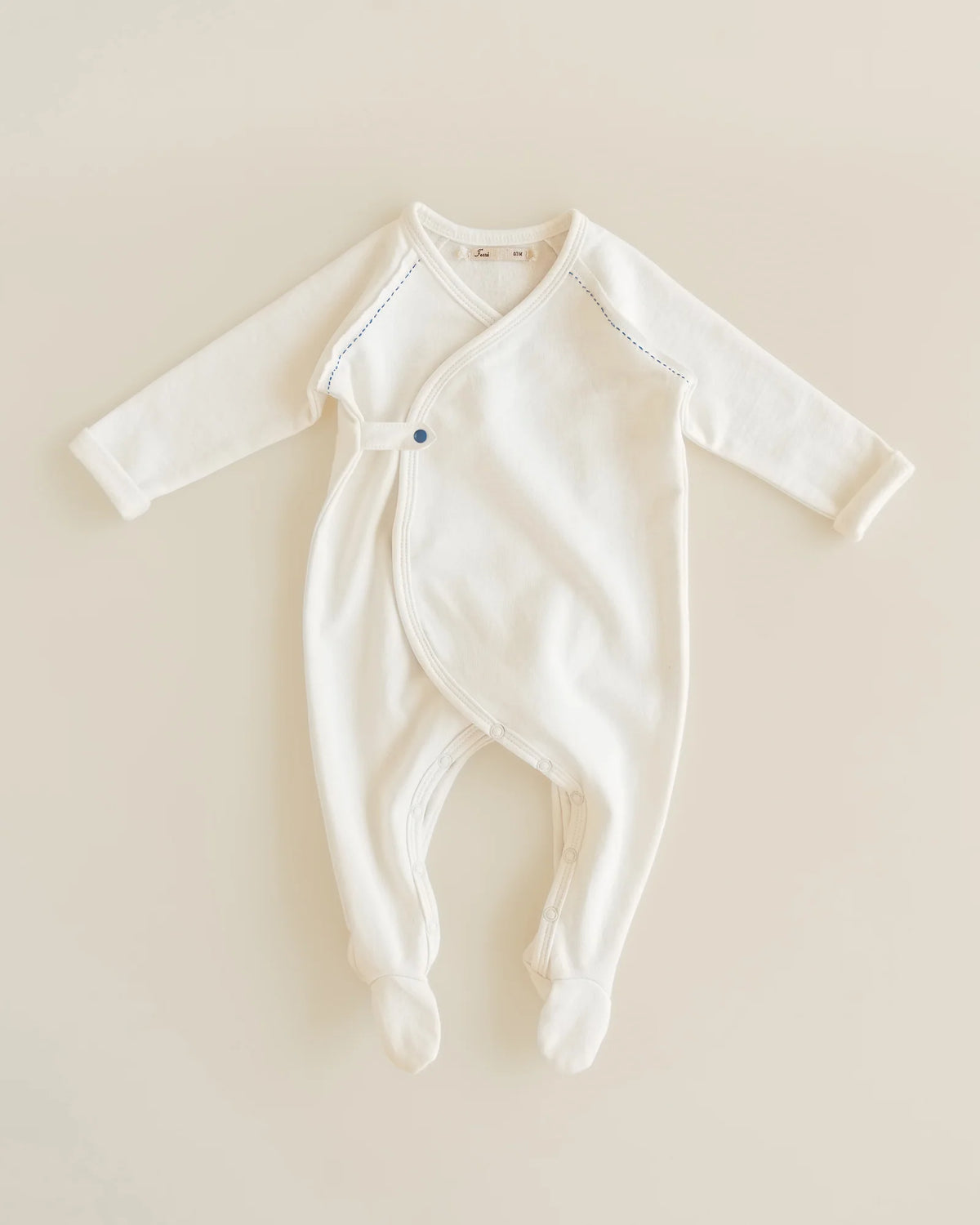 ferne baby Flap Footie - Milk with Blue Stitching