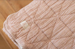 New Grain Quilted Crib Blanket in Petal