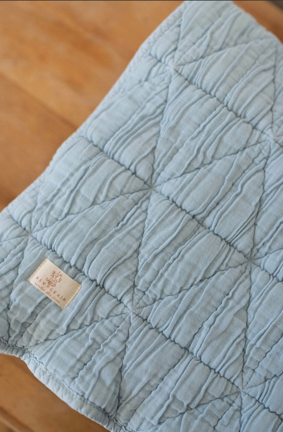 New Grain Quilted Crib Blanket in Powder