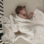 New Grain Quilted Crib Blanket in Natural